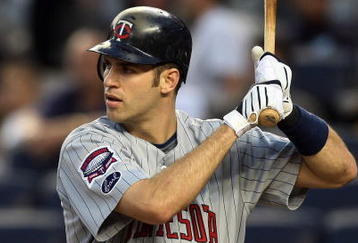 NEW YORK - OCTOBER 09:  Joe Mauer #7 of the Minnesota Twins bats against the New York Yankees in Game Two of the ALDS during the 2009 MLB Playoffs at Yankee Stadium on October 9, 2009 in the Bronx borough of New York City.  (Photo by Jim McIsaac/Getty Images)