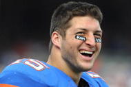 GAINESVILLE, FL - NOVEMBER 21: Quarterback Tim Tebow #15 of the Florida Gators watches fourth-quarter play against the Florida International University Golden Panthers, November 21, 2009 at Ben Hill Griffin Stadium in Gainesville, Florida.  (Photo by Al Messerschmidt/Getty Images)