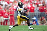 COLUMBUS, OH - SEPTEMBER 24: Albert Young #21 of Iowa makes a catch against Ohio State during the second quarter on September 24, 2005 at Ohio Stadium in Columbus, Ohio. Ohio State defeated Iowa 31-6. (Photo by Harry How/Getty Images)