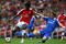 LONDON - MAY 10:  Emmanuel Adebayor of Arsenal is tackled by Branislav Ivanovic of Chelsea during the Barclays Premier League match between Arsenal and Chelsea at the Emirates Stadium on May 10, 2009 in London, England.  (Photo by Jamie McDonald/Getty Images)
