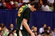 DAYTON, OH - MARCH 20: Ryan Rossiter #22 of the Siena Saints winces on the court during a game against the Ohio State Buckeyes during the first round of the NCAA Division I Men's Basketball Tournament at the University of Dayton Arena on March 20, 2009 in Dayton, Ohio.  (Photo by Andy Lyons/Getty Images)