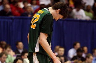 DAYTON, OH - MARCH 20: Ryan Rossiter #22 of the Siena Saints winces on the court during a game against the Ohio State Buckeyes during the first round of the NCAA Division I Men's Basketball Tournament at the University of Dayton Arena on March 20, 2009 in Dayton, Ohio.  (Photo by Andy Lyons/Getty Images)