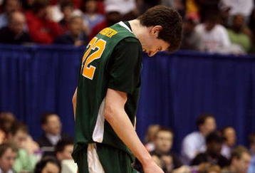DAYTON, OH - MARCH 20: Ryan Rossiter #22 of the Siena Saints winces on the court during a game against the Ohio State Buckeyes during the first round of the NCAA Division I Men's Basketball Tournament at the University of Dayton Arena on March 20, 2009 in Dayton, Ohio.  (Photo by Andy Lyons/Getty Images)