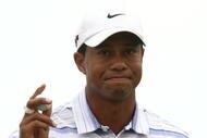 MELBOURNE, AUSTRALIA - NOVEMBER 14:  Tiger Woods of the USA acknowledges the crowd on the 4th hole during round three of the 2009 Australian Masters at Kingston Heath Golf Club on November 14, 2009 in Melbourne, Australia.  (Photo by Quinn Rooney/Getty Images)
