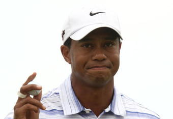 MELBOURNE, AUSTRALIA - NOVEMBER 14:  Tiger Woods of the USA acknowledges the crowd on the 4th hole during round three of the 2009 Australian Masters at Kingston Heath Golf Club on November 14, 2009 in Melbourne, Australia.  (Photo by Quinn Rooney/Getty Images)