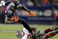 DENVER - NOVEMBER 26: Wide receiver Brandon Marshall #15 of the Denver Broncos makes a pass reception and is tackled by Terrell Thomas #24 of the New York Giants during NFL action at Invesco Field at Mile High on November 26, 2009 in Denver, Colorado. (Photo by Doug Pensinger/Getty Images)