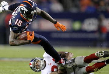 DENVER - NOVEMBER 26:  Wide receiver Brandon Marshall #15 of the Denver Broncos makes a pass reception and is tackled by Terrell Thomas #24 of the New York Giants during NFL action at Invesco Field at Mile High on November 26, 2009 in Denver, Colorado.  (Photo by Doug Pensinger/Getty Images)