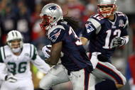 FOXBORO, MA - NOVEMBER 22:  Tom Brady #12 of the New England Patriots hands the ball off to Laurence Maroney #39 in the third quarter against against the New York Jets on November 22, 2009 at Gillette Stadium in Foxboro, Massachusetts. The Patriots defeated the Jets 31-14.  (Photo by Elsa/Getty Images)