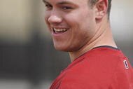 KISSIMMEE, FL - FEBRUARY 27: Koby Clemens smiles as his father, Roger Clemens, throws batting practice to the minor league team at Houston Astros Spring Training at Osceola County Stadium on February 27, 2008 in Kissimmee, Florida. The U.S. House Oversight and Government Reform Committee has asked the Justice Department to investigate whether Roger Clemens committed perjury while testifying in front of the committee. (Photo by Scott A. Miller/Getty Images)