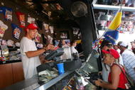 INDIANAPOLIS - AUGUST 06:  Fans shop at the 'Talladega Nights: The Ballad of Ricky Bobby' souvenir stand prior to the NASCAR Nextel Cup Series Allstate 400 at the Brickyard on August 6, 2006 at Indianapolis Motor Speedway in Indianapolis, Indiana.  (Photo by Matthew Stockman/Getty Images for NASCAR)