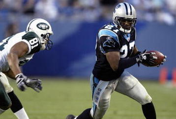 CHARLOTTE, NC - NOVEMBER 13:  Marlon McCree #27 of the Carolina Panthers carries the ball during the game with the New York Jets at Bank of America Stadium on November 13, 2005 in Charlotte, North Carolina. The Panthers won 30-3. (Photo by Craig Jones/Getty Images)