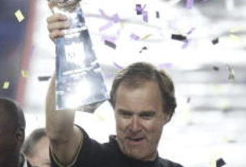 28 Jan 2001: Head coach Brian Billick of the Baltimore Ravens is presented the Lombardi Trophy after defeating the New York Giants during Super Bowl XXXV at Raymond James Stadium in Tampa, Florida. The Ravens defeated the Giants 34-7. DIGITAL IMAGE. Mandatory Credit: Brian Bahr/ALLSPORT