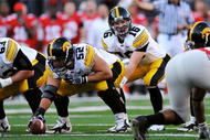 COLUMBUS, OH - NOVEMBER 14: Quarterback James Vandenberg #16 of the Iowa Hawkeyes takes the snap from center against the Ohio State Buckeyes at Ohio Stadium on November 14, 2009 in Columbus, Ohio. (Photo by Jamie Sabau/Getty Images)