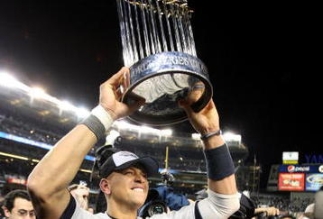 NEW YORK - NOVEMBER 04:  Alex Rodriguez #13 of the New York Yankees celebrates with the trophy after their 7-3 win  against the Philadelphia Phillies in Game Six of the 2009 MLB World Series at Yankee Stadium on November 4, 2009 in the Bronx borough of New York City.  (Photo by Jed Jacobsohn/Getty Images)