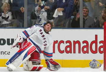 TORONTO - DECEMBER 16:  Henrik Lundqvist #30 of the New York Rangers tries to collect himself after losing his helmet while giving up the 5th goal of the game scored by the Toronto Maple Leafs during their NHL game at the Air Canada Centre on December 16, 2006 in Toronto, Ontario, Canada.  (Photo By Dave Sandford/Getty Images)