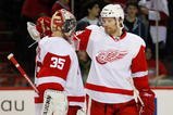 MONTREAL- NOVEMBER 21:  Brad Stuart #23 celebrates with Jimmy Howard #35 of the Detroit Red Wings after defeating the Montreal Canadiens 3-2 in shootouts in the NHL game on November 21, 2009 at the Bell Centre in Montreal, Quebec, Canada.  The Red Wings defeated the Canadiens 3-2 in a shootout.  (Photo by Richard Wolowicz/Getty Images)