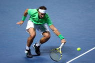 LONDON, ENGLAND - NOVEMBER 27:  Rafael Nadal of Spain returns the ball during the men's singles round robin match against Novak Djokovic of Serbia during the Barclays ATP World Tour Finals at the O2 Arena on November 27, 2009 in London, England.  (Photo by Clive Brunskill/Getty Images)