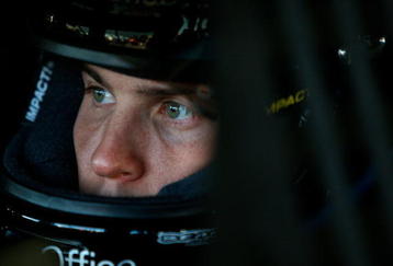 FORT WORTH, TX - NOVEMBER 07:  Denny Hamlin, driver of the #11 FedEx Toyota, sits in his car during practice for the NASCAR Sprint Cup Series Dickies 500 at Texas Motor Speedway on November 7, 2009 in Fort Worth, Texas.  (Photo by Chris Graythen/Getty Images)