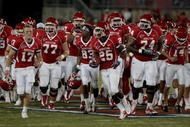 HOUSTON - SEPTEMBER 26: The University of Houston runs onto the field before the Houston Cougars played against the Texas Tech Red Raiders at Robertson Stadium on September 26, 2009 in Houston, Texas.  (Photo by Thomas B. Shea/Getty Images)