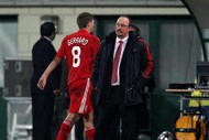 BUDAPEST, HUNGARY - NOVEMBER 24:  Steven Gerrard of Liverpool walks past Manager Rafael Benitez as he is substituted during the UEFA Champions League group E match between Debrecen and Liverpool at the Ferenc Puskas Stadium on November 24, 2009 in Budapest, Hungary.  (Photo by Richard Heathcote/Getty Images)