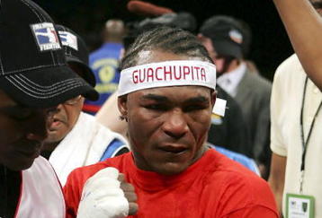 LAS VEGAS - SEPTEMBER 16:  Joan Guzman of the Dominican Republic celebrates after his WBO junior lightweight titile fight against Jorge Rodrigo Barrios of Argentina at the MGM Grand Garden Arena September 16, 2006 in Las Vegas, Nevada. Guzman won the title by split decision against Barrios. (Photo by Ethan Miller/Getty Images) 