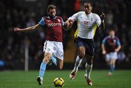 BIRMINGHAM, ENGLAND - NOVEMBER 28: Tom Huddlestone of Tottenham Hotspur battles for the ball with Carlos Cuellar of Aston Villa during the Barclays Premier League match between Aston Villa and Tottenham Hotspur at Villa Park on November 28, 2009 in Birmingham, England. (Photo by Shaun Botterill/Getty Images)