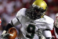 PISCATAWAY, NJ - NOVEMBER 12:  Theo Wilson #9 of the South Florida Bulls runs the ball against the Rutgers Scarlet Knights at Rutgers Stadium on November 12, 2009 in Piscataway, New Jersey.  (Photo by Jim McIsaac/Getty Images)