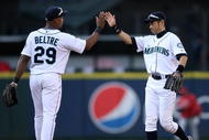 SEATTLE - SEPTEMBER 02:  Ichiro Suzuki #51 and Adrian Beltre #29 of the Seattle Mariners celebrate after beating the Los Angeles Angels of Anaheim 3-0 on September 2, 2009 at Safeco Field in Seattle, Washington. (Photo by Otto Greule Jr/Getty Images)