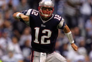 IRVING, TX - OCTOBER 14:  Quarterback Tom Brady #12 of the New England Patriots celebrates a touchdown in the fourth quarter against the Dallas Cowboys at Texas Stadium on October 14, 2007 in Irving, Texas.  (Photo by Ronald Martinez/Getty Images)