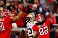 ATLANTA - NOVEMBER 28:  Aron White #81 and Michael Moore #82 of the Georgia Bulldogs celebrate Moore's touchdown against the Georgia Tech Yellow Jackets at Bobby Dodd Stadium on November 28, 2009 in Atlanta, Georgia.  (Photo by Kevin C. Cox/Getty Images)