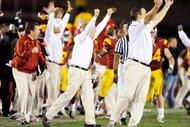 LOS ANGELES, CA - NOVEMBER 28:  Pete Carroll (C) of the USC Trojans celebrates after Damian Williams #18 wide receiver of the USC Trojans scored a 48-yard touchdown pass after UCLA Bruins called a time out with one minute remaining in the NCAA college football game at Los Angeles Memorial Coliseum on November 28, 2009 in Los Angeles, California.  (Photo by Kevork Djansezian/Getty Images)