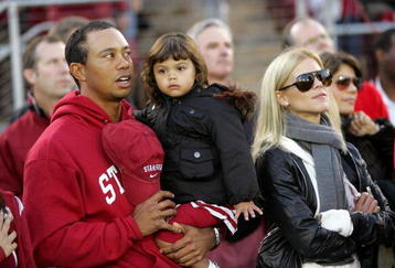 PALO ALTO, CA - NOVEMBER 21:  Honorary Standford Cardinal captain Tiger Woods his daugher, Sam, and wife, Elin Nordegren, stand on the sidelines before the Cardinal game against the California Bears at Stanford Stadium on November 21, 2009 in Palo Alto, California.  (Photo by Ezra Shaw/Getty Images)