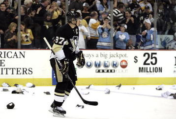 PITTSBURGH, PA - NOVEMBER 28:  Sidney Crosby #87 of the Pittsburgh Penguins skates through hats after scoring his third goal of the game against the New York Rangers in the third period at Mellon Arena on November 28, 2009 in Pittsburgh, Pennsylvania.  Penguins won 8-3.  (Photo by Justin K. Aller/Getty Images)