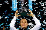 LONDON, ENGLAND - NOVEMBER 29:  Nikolay Davydenko of Russia holds the trophy as he celebrates winning the men's singles final match against Juan Martin Del Potro of Argentina during the Barclays ATP World Tour Finals at the O2 Arena on November 29, 2009 in London, England.  (Photo by Julian Finney/Getty Images)