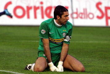 CAGLIARI, ITALY - NOVEMBER 29:  Juventus goalkeeper Gianluigi Buffon looks back at the goal he conceded to Alessandro Matri #32 of Cagliari, while Francesco Pisano #14 of Cagliari celelbrates during the Serie A match between Cagliari Calcio and Juventus at Stadio Sant'Elia on November 29, 2009 in Cagliari, Italy.  (Photo by Enrico Locci/Getty Images)