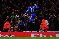 LONDON, ENGLAND - NOVEMBER 29:  Didier Drogba of Chelsea celebrates scoring his second goal during the Barclays Premier League match between Arsenal and Chelsea at the Emirates Stadium on November 29, 2009 in London, England.  (Photo by Mike Hewitt/Getty Images)