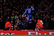 LONDON, ENGLAND - NOVEMBER 29:  Didier Drogba of Chelsea celebrates scoring his second goal during the Barclays Premier League match between Arsenal and Chelsea at the Emirates Stadium on November 29, 2009 in London, England.  (Photo by Mike Hewitt/Getty Images)