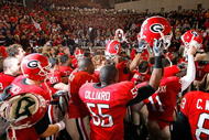 ATLANTA - NOVEMBER 28:  The Georgia Bulldogs celebrate their 30-24 win over the Georgia Tech Yellow Jackets at Bobby Dodd Stadium on November 28, 2009 in Atlanta, Georgia.  (Photo by Kevin C. Cox/Getty Images)
