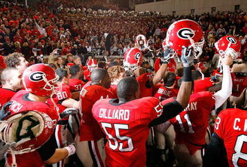 ATLANTA - NOVEMBER 28:  The Georgia Bulldogs celebrate their 30-24 win over the Georgia Tech Yellow Jackets at Bobby Dodd Stadium on November 28, 2009 in Atlanta, Georgia.  (Photo by Kevin C. Cox/Getty Images)