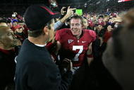 PALO ALTO, CA - NOVEMBER 28:  Toby Gerhart #7 of the Stanford Cardinal is congratulated by head coach Jim Harbaugh after they beat the Notre Dame Fighting Irish at Stanford Stadium on November 28, 2009 in Palo Alto, California.  (Photo by Ezra Shaw/Getty Images)