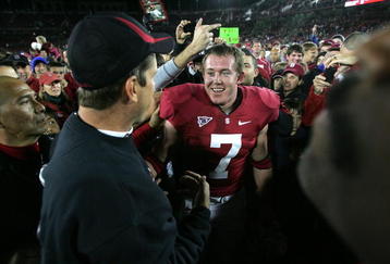 PALO ALTO, CA - NOVEMBER 28:  Toby Gerhart #7 of the Stanford Cardinal is congratulated by head coach Jim Harbaugh after they beat the Notre Dame Fighting Irish at Stanford Stadium on November 28, 2009 in Palo Alto, California.  (Photo by Ezra Shaw/Getty Images)