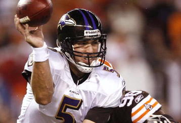 CLEVELAND - NOVEMBER 16: Joe Flacco #5 of the Baltimore Ravens attempts to throw a pass in the second quarter as he is pressured by Robaire Smith #98 of the Cleveland Browns at Cleveland Browns Stadium on November 16, 2009 in Cleveland, Ohio.  (Photo by Matt Sullivan/Getty Images)