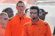 STILLWATER, OK - SEPTEMBER 05: Head coach Mike Gundy of the Oklahoma State Cowboys walks the sidelines during the college football game against the Georgia Bulldogs at Boone Pickens Stadium on September 5, 2009 in Stillwater, Oklahoma. The Cowboys defeated the Bulldogs 24-10. (Photo by Christian Petersen/Getty Images)