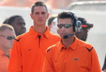 STILLWATER, OK - SEPTEMBER 05:  Head coach Mike Gundy of the Oklahoma State Cowboys walks the sidelines during the college football game against the Georgia Bulldogs at Boone Pickens Stadium on September 5, 2009 in Stillwater, Oklahoma.  The Cowboys defeated the Bulldogs 24-10.  (Photo by Christian Petersen/Getty Images)