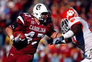 COLUMBIA, SC - NOVEMBER 28: Patrick DiMarco #47 of the South Carolina Gamecocks fights off the tackle of Kavell Conner #33 of the Clemson Tigers at Williams-Brice Stadium on November 28, 2009 in Columbia, South Carolina. (Photo by Scott Halleran/Getty Images)