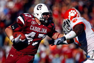 COLUMBIA, SC - NOVEMBER 28:  Patrick DiMarco #47 of the South Carolina Gamecocks fights off the tackle of Kavell Conner #33 of the Clemson Tigers at Williams-Brice Stadium on November 28, 2009 in Columbia, South Carolina.  (Photo by Scott Halleran/Getty Images)