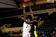 ORLANDO, FL - NOVEMBER 27: Mike McFadden #1 of the Iona Gaels attempts a shot over Quincy Acy #4 of the Baylor Bears during the Old Spice Classic at Disney's Milk House on November 27, 2009 in Orlando, Florida. (Photo by Sam Greenwood/Getty Images)