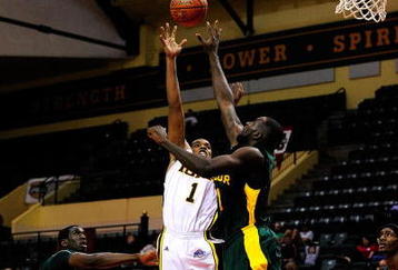 ORLANDO, FL - NOVEMBER 27:  Mike McFadden #1 of the Iona Gaels attempts a shot over Quincy Acy #4 of the Baylor Bears during the Old Spice Classic at Disney's Milk House on November 27, 2009 in Orlando, Florida.  (Photo by Sam Greenwood/Getty Images)
