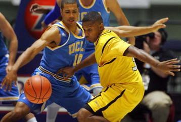 ANAHEIM, CA - NOVEMBER 29:  Stephan Gilling #33 of Long Beach State loses the ball on the dribble drive to the basket as Mustafa Abdul-Hamid #10 of UCLA defends in the first half during the 76 Classic at Anaheim Convention Center on November 29, 2009 in Anaheim, California.  (Photo by Victor Decolongon/Getty Images)