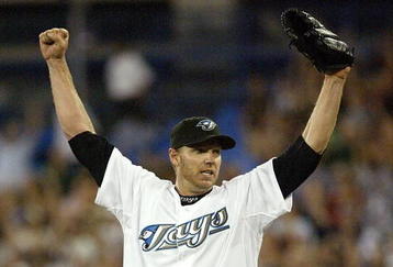 TORONTO - AUGUST 14:  Roy Halladay #32 of the Toronto Blue Jays celebrates his complete game win against the Los Angeles Angels of Anaheim on August 14, 2007 at the Rogers Centre in Toronto, Ontario, Canada.  (Photo by Dave Sandford/Getty Images)